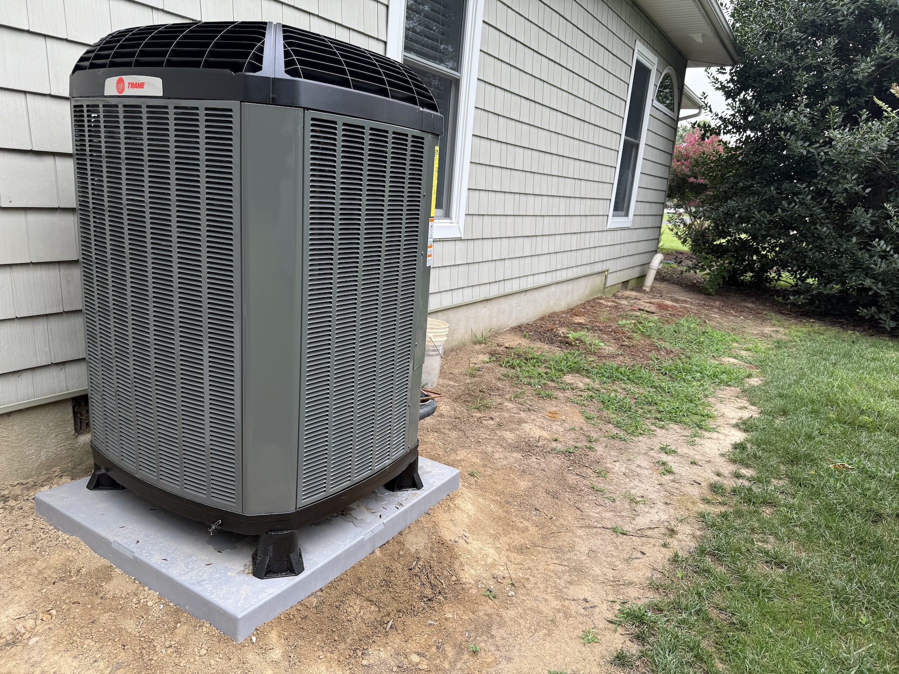 Trane heat pump installed outside residential home