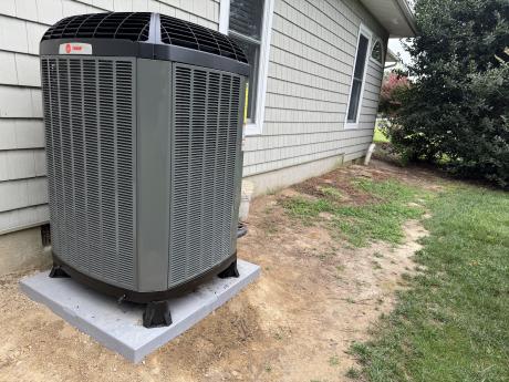 Trane heat pump installed outside residential home