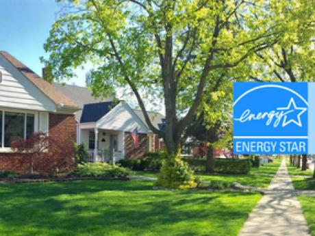 home with green grass and the energy star logo